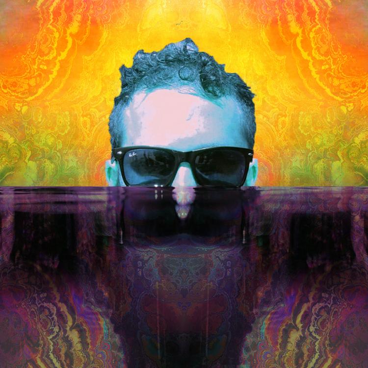 Butterz in technicolor with glasses on coming out of the water