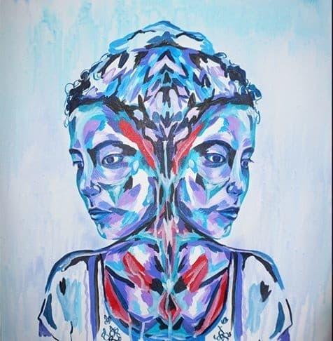 Mirrored image of female looking into the distance