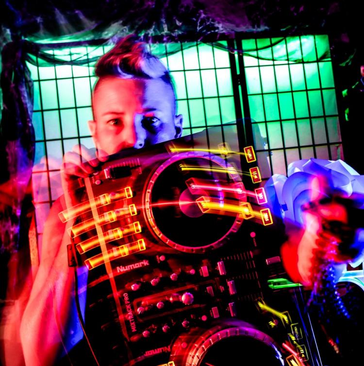 DJ Black Rose holding mixing decks in front of her
