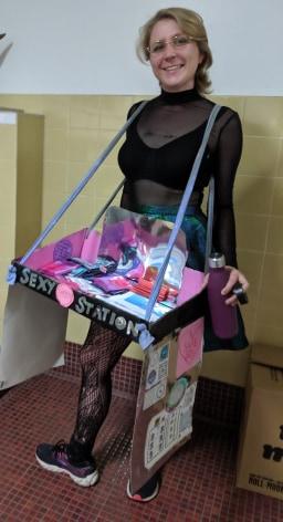Lady with old time dispenser handing out safe sex kits