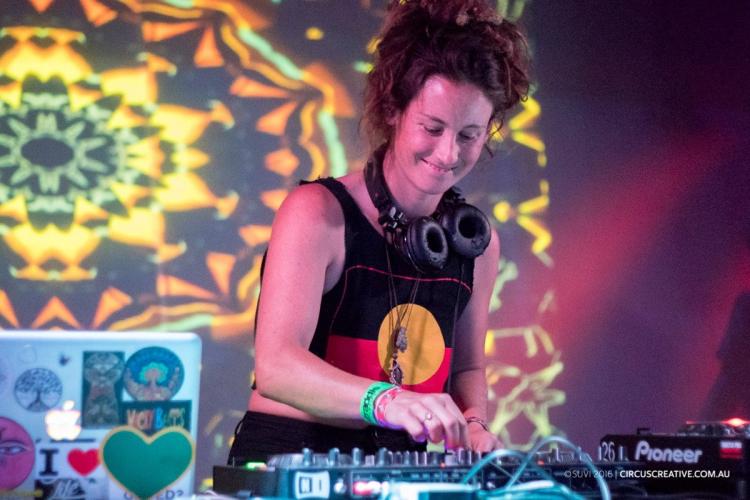 Woman DJing on stage