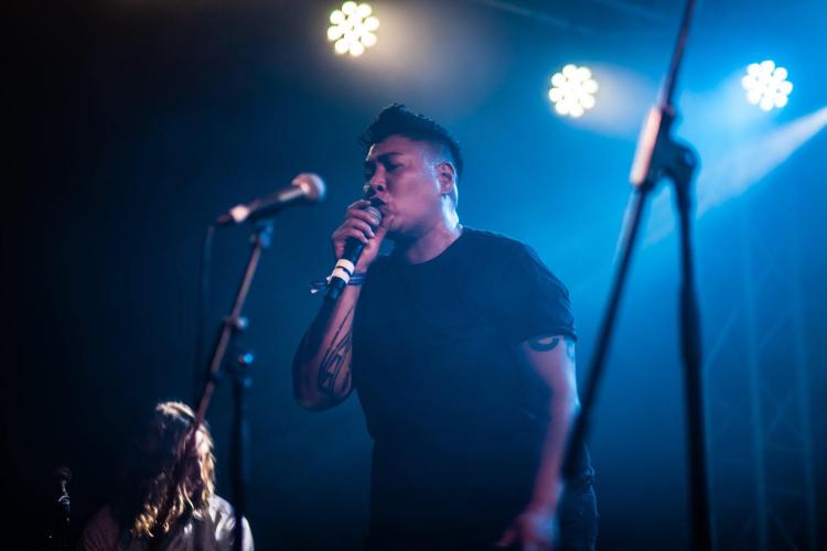 Signer on stage with microphone