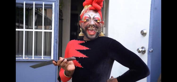 Drag Queen Radha Performer wearing black and red