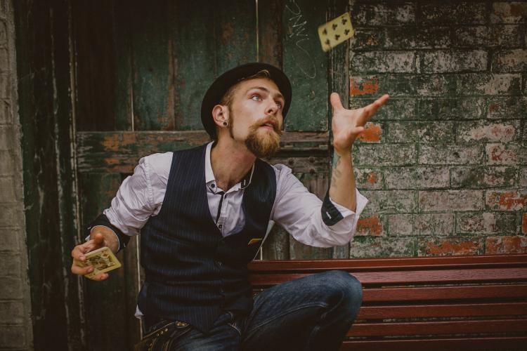 The Bewildering Mr. T. Bedlam performing card tricks
