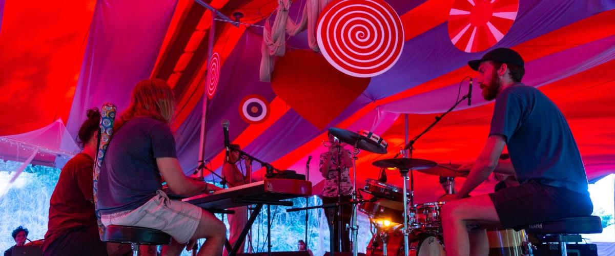 A group of festival goers jamming on the Jambala stage