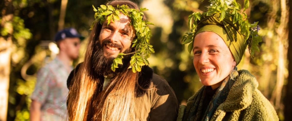 Smiling people with plants in their hair